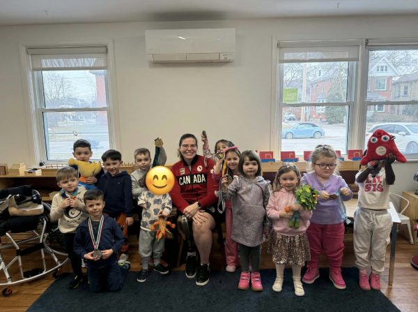 Group of students with Paralympian Darda Geiger.